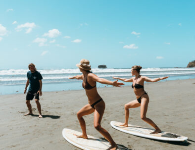 surfing at a nearby beach in affordable nicaragua