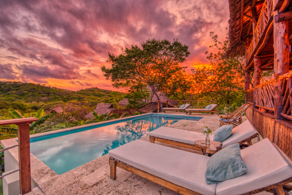 SUNSET photo of the pool at Eden on the Chocolata, which is an affordable wellness retreat