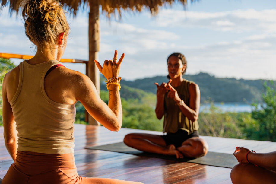 Meditation class in a ocean and jungle view yoga shala